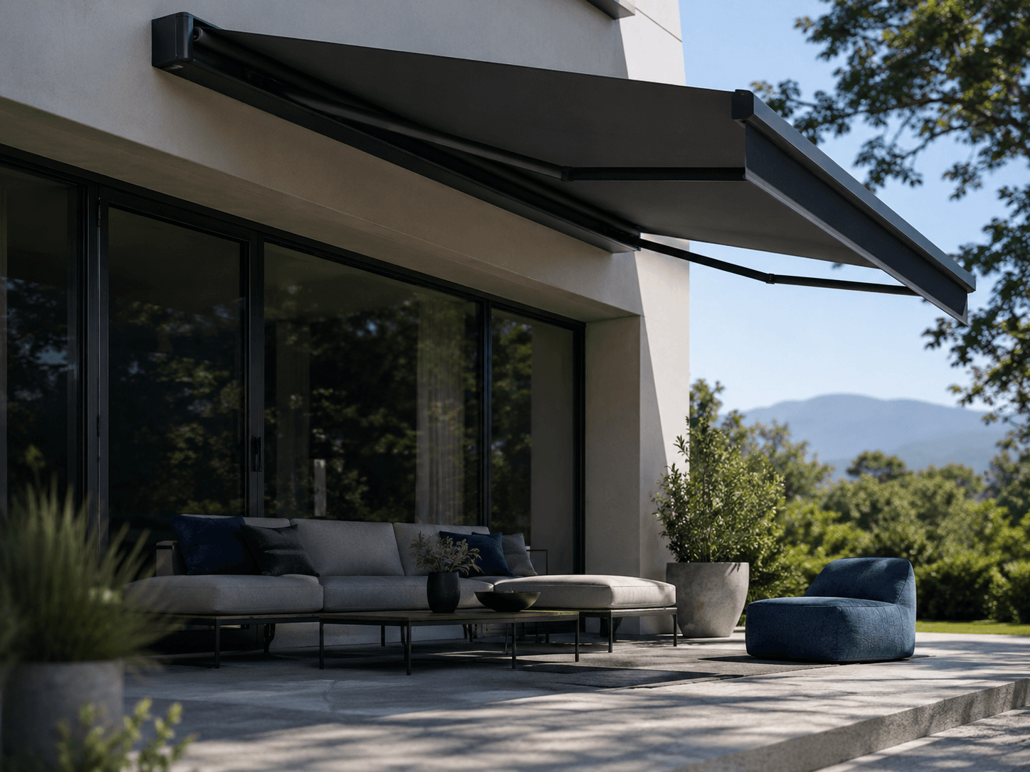 VELARIA Cassette awning extended over a terrace, fabric folding fully away into the cassette when closed